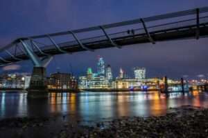 Millennium Bridge and The City of London at night, City of London, London, England
